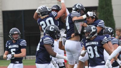 Concordia football players celebrating a win