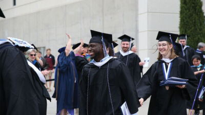 Student taking a graduation photo