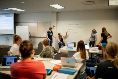 Students presenting in an education class