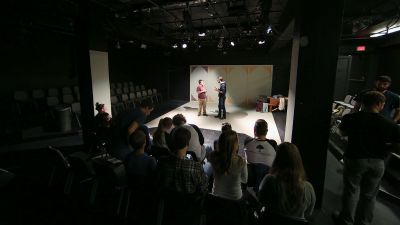 Two students giving a improve performance in the Black Box Studio