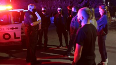 A group of law students having a conversation with a Police Officer