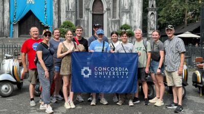 Concordia faculty and students in front of a cathedral on a study tour in Vietnam