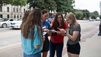 Concordia University, Nebraska students participate in a scavenger hunt in downtown Seward.