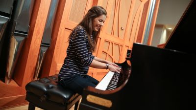 Student playing a Steinway piano in the Recital Hall