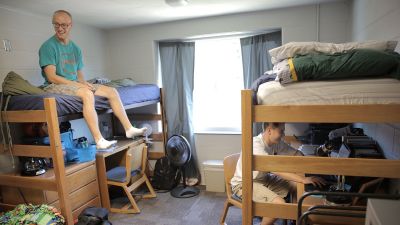 A picture of two students in their dorm room