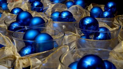 Decorative vases filled with blue Christmas ornaments