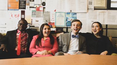 A group of Concordia students on the speech team strategize.