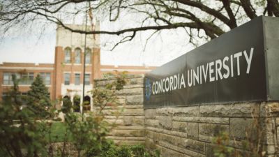 A photo of Concordia University, Nebraska's front signage and Weller Hall in the background.