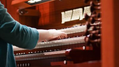 Music student playing the organ in the Recital Hall