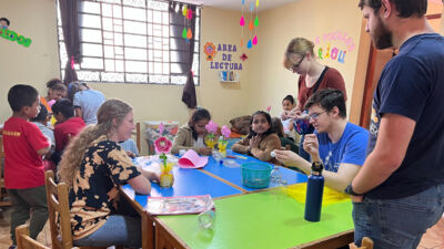 (Left to right) Lydia Schultz, Esther Langness, Aarin Dean, and Devon Reitz assist with Sunday School activities.