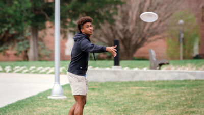 A man throwing a frisbee