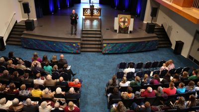 Pastor Mathias giving a sermon in chapel