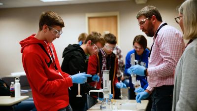 Ag summit attendees conducting a science experiment