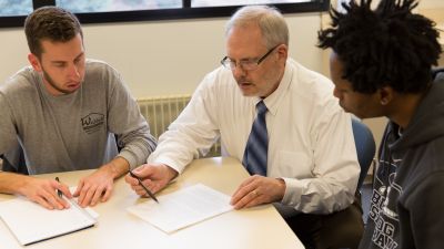 Professor advising students