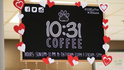 A picture of a 10:31 Coffee House billboard