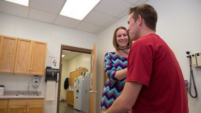 A nurse checking a students heart rate