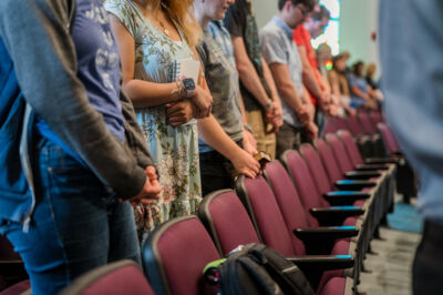 Students praying in chapel. 