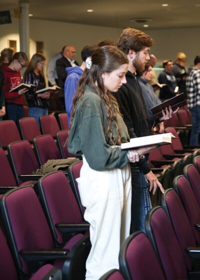 Students joining in song during daily chapel in Weller