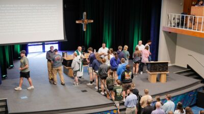 Pastor Mathias giving a sermon in chapel