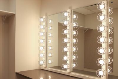 Lights surrounding mirrors in a dressing room for the Black Box Theater in the Borland Center.
