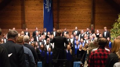 Dr. Kurt von Kampen directing a combined men's and women's choral piece at a Christmas at Concordia concert